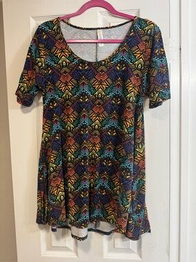 LuLaRoe Perfect Tee. Black w/bright abstract pattern. High low hem. Side slits.